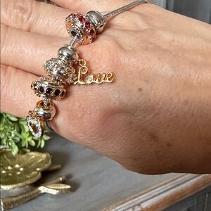 Elegant Gold and Silver Charm Bracelet